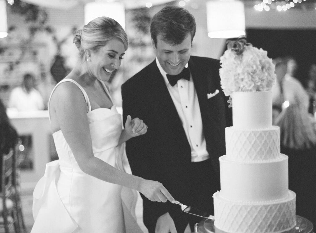 bride and groom cutting cake